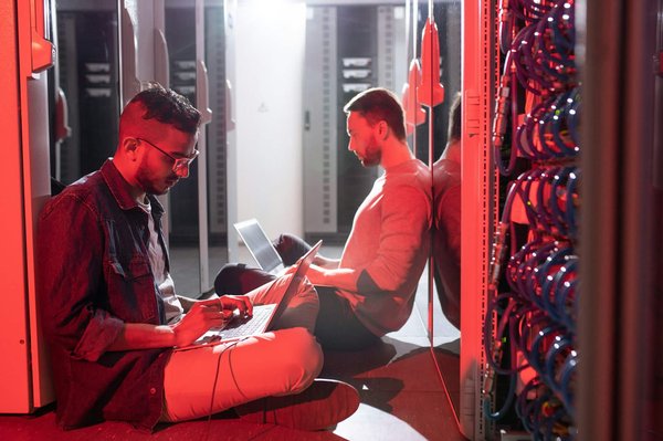 What are the steps to configure a Ubiquiti UniFi Dream Machine Pro for advanced VLAN management in a small business?